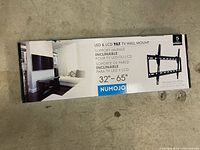 Front of boxed Numojo tilt TV wall mount showing product info
