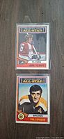 Fronts of both 1974 O-Pee-Chee All-Star cards showing Bobby Clarke and Phil Esposito