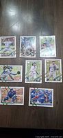 Front view of all eight Topps Holiday Blue Jays cards laid out on table
