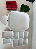 Group shot of assorted ceramic dishes arranged on countertop