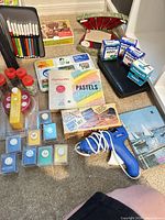 Overview showing pastels, hobby knife set, glue gun, ink boxes, marker case, punches