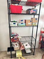 Full frontal view showing all five wire shelves and posts