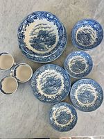 All pieces laid out showing groupings of plates, bowls and cups