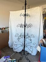 full view of black metal ornament tree with five tiers