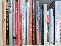 Shelf view of animal, art and photography titles including multiple cat books, American Wildflower Florilegium, Albrecht Dürer, Dogs on the Move