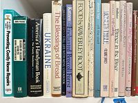 Left section of shelf showing home repair, Ukraine, bread and broccoli forest titles
