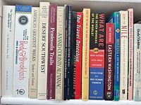 Single shelf showing roughly 20 of the travel, field and regional guidebooks in the lot