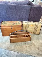 Group shot of dome chest, suitcase and tote