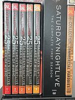 Spines showing 25 Years of Music Vols 1–5, Complete First Season box, and Commercial Parodies