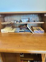 Shelf showing multiple boxed pens and loose pen