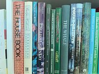 Spines of gardening, nature and travel hardcovers including The House Book, Antique Flowers, Winterthur Garden, English Country, American Country Style, Found Objects, The Whale and Central Park: An American Masterpiece