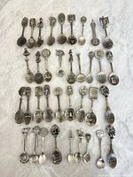 All 36 spoons laid out in rows showing fronts