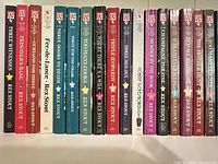 Left section of shelf showing first eighteen Rex Stout Nero Wolfe paperbacks with Bantam Crime Line spines