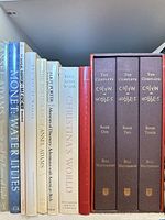 Spines of several art books and the three-volume Calvin & Hobbes boxed set