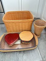 Overall view: rectangular basket, tall vase, serving tray basket with heart-shaped and round lidded baskets on top