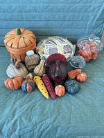 All items grouped on couch showing variety of Thanksgiving decor