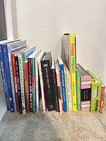 Front view of entire lot showing books upright and paper packs stacked