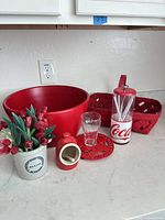 Group shot of all seven red themed kitchen and decor items