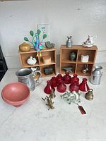 Group shot of all decorative miniatures displayed on countertop showing materials and scale