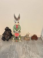 Group shot of all four rabbit figurines