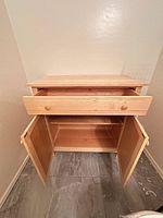 Drawer open, doors open showing interior shelf