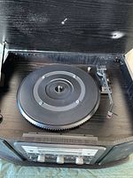 Top view showing turntable platter and tonearm under open dust cover