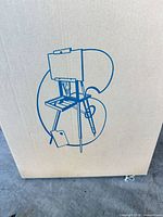 Sealed cardboard box showing line drawing of the wooden field easel