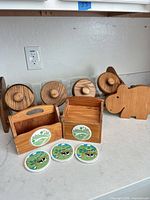 All items grouped: spice rack with jars, caddy, recipe box, coasters, hippo board