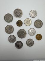All 13 Mexican coins laid out to show obverses