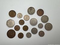Reverse designs of all 18 coins laid out