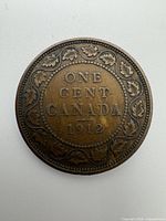Reverse showing ONE CENT CANADA 1912 with maple-leaf wreath
