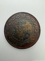 Reverse side of 1919 Canada one-cent large cent coin showing denomination and date