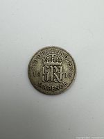 Reverse of 1938 sixpence showing crowned monogram, date and denomination