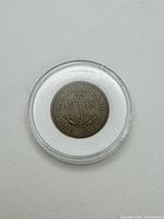 Reverse of 1938 Newfoundland one cent coin showing pitcher plant design and inscriptions