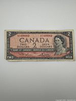 Obverse showing portrait, serial number 1498062, denomination