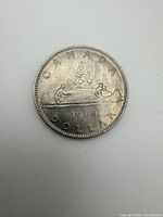 Reverse showing Voyageur canoe design and date 1968