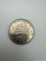 Reverse side showing voyageur canoe design and 1972 date