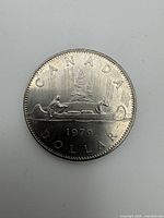 Reverse side of 1979 Canadian Voyageur dollar coin