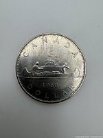 Reverse side showing CANADA DOLLAR, canoe design, 1980 date