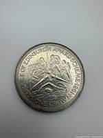 Reverse showing Duke of Edinburgh Award Scheme design and ONE CROWN denomination