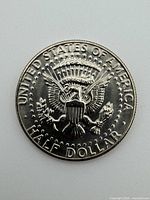 Reverse of 1981 Kennedy half dollar showing UNITED STATES OF AMERICA inscription and heraldic eagle