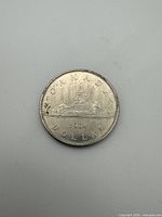 Reverse side showing canoe with voyageurs, date 1984, CANADA DOLLAR legend