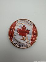 Obverse showing maple leaf, fishing rod, weight and fineness markings