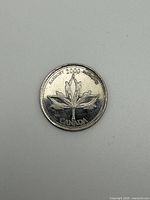 Reverse showing maple leaf Harmony design and date