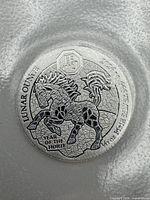 Obverse showing prancing horse, legends 'LUNAR OUNCE', '2026', '.999 SILVER', and 'YEAR OF THE HORSE'