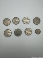 Obverse view showing salmon 10p coins and horse 20p coin