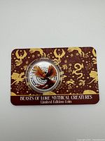 Front of encapsulated Phoenix silver coin on presentation card
