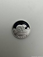 Reverse view showing beaver, trees and text "1 GRAM 999 SILVER"