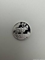 Reverse side showing moose design and weight/purity inscription