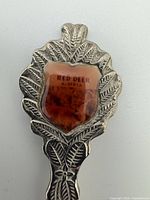 Close-up of enamel crest with Red Deer Alberta text